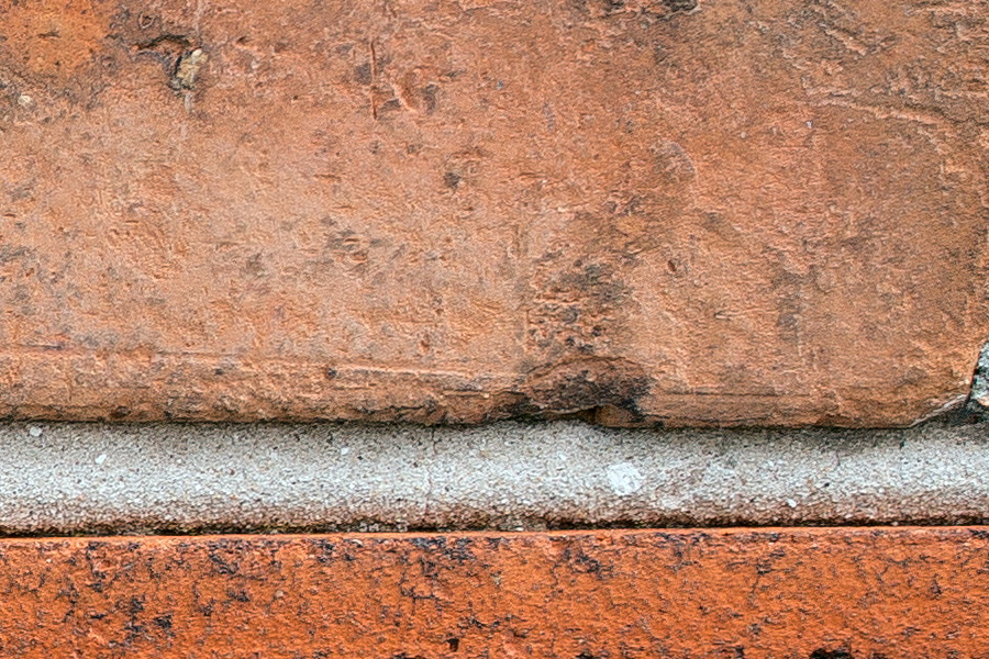 Photo 25095: Red brick wall with a red frieze.