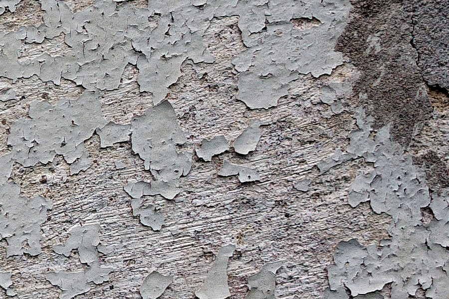 Photo 25161: Worn, plastered, grey wall with dark grey spots