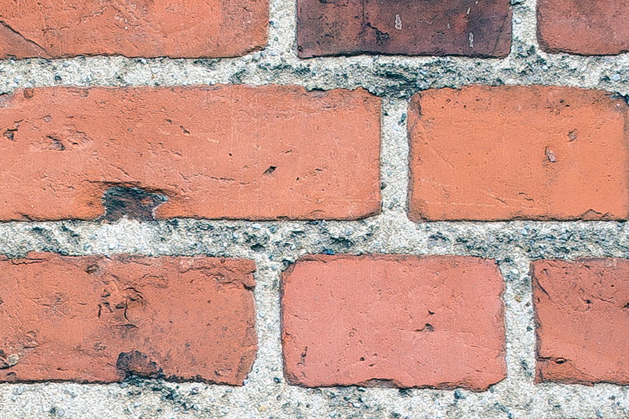 Photo 25312: Lopsided, red brick wall with indentation