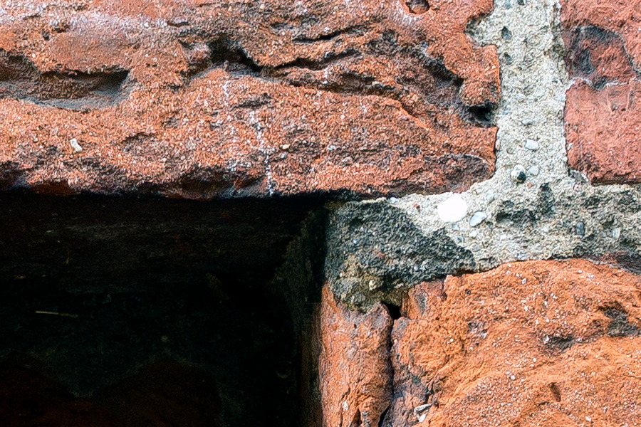 Photo 25313: Red brick wall with red and black bricks and narrow indentation