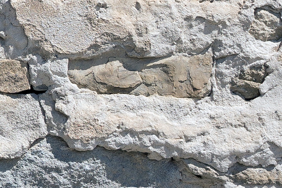 Photo 25466: Decayed, plastered stone wall in white and light brown colours