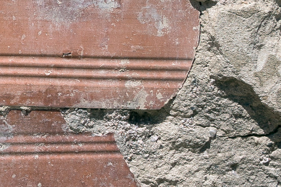 Photo 25469: Decayed stone wall repaired with red tiles