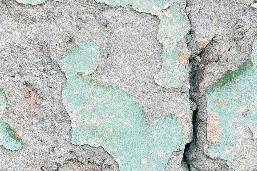 Photo 25614: Decayed, plastered, red brick wall with remains of light green and light yellow colours