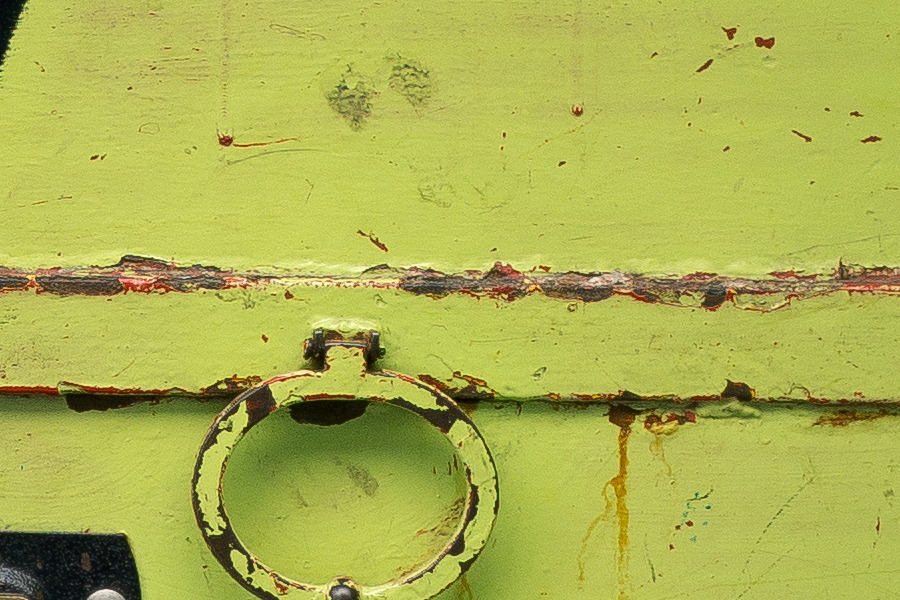 Photo 26062: Worn, light green metal double door with grafitti arrow