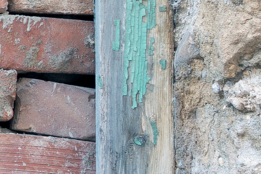 Photo 26221: Decayed, plastered wall with light green window blocked by loose bricks