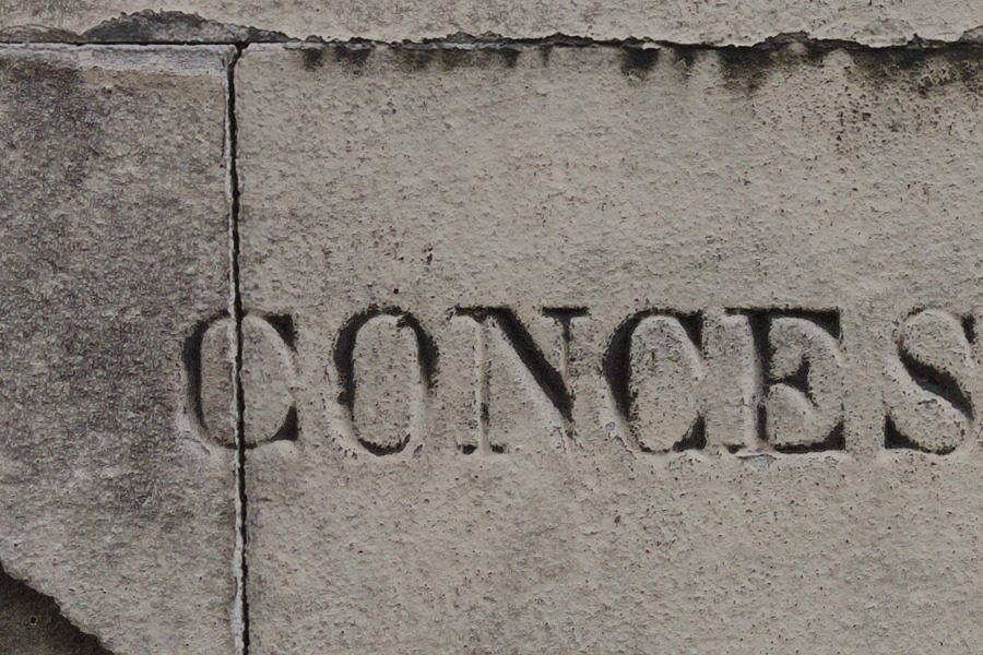 Photo 27403: Grey stone wall with text 