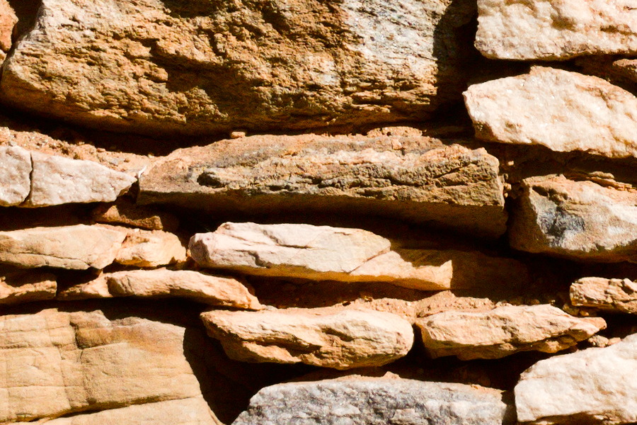 Photo 27408: Yellow stone wall with small and large stones