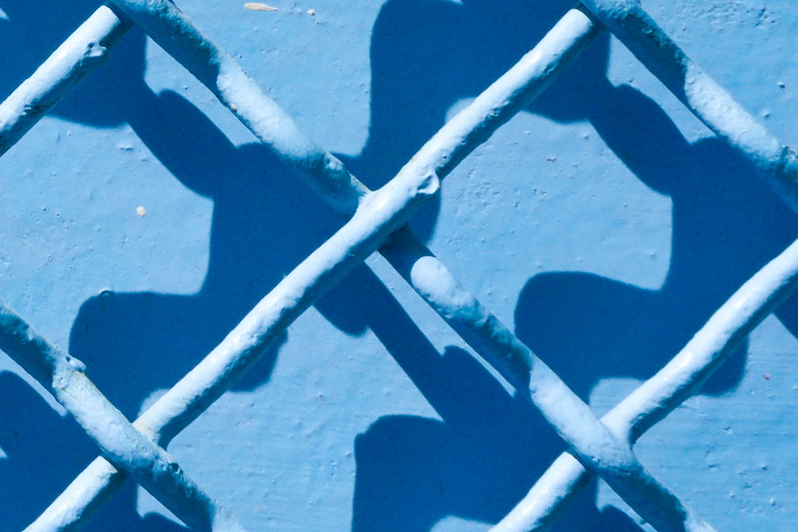 Photo 27409: Blue metal wall with blue grating. Well maintained.