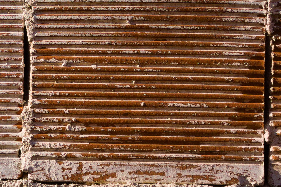 Photo 27419: Rough, red wall of bricks.