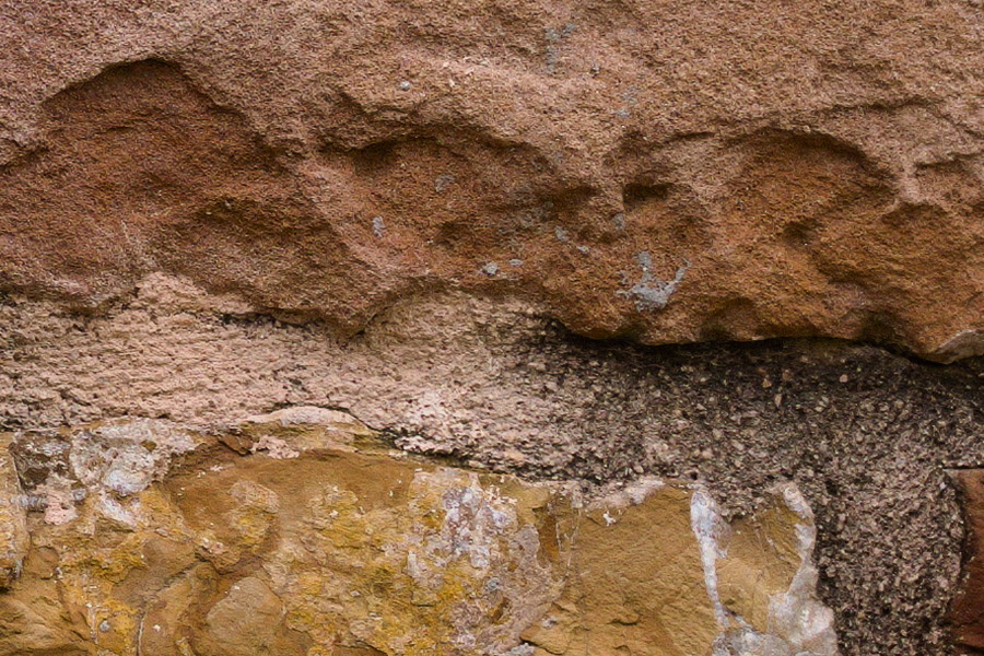 Photo 27437: Stone wall with yellow, brown and red stones. Well maintained.