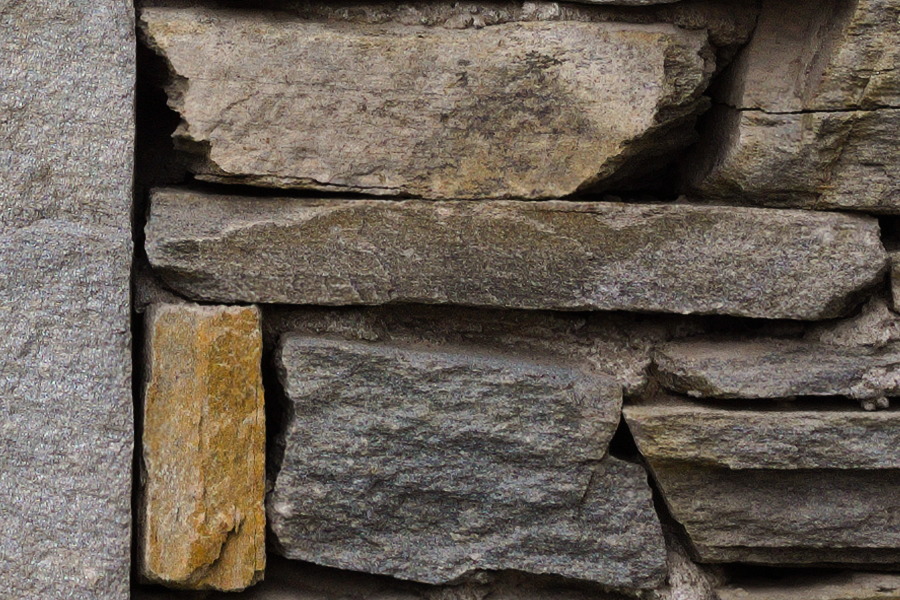 Photo 27465: Stone wall with grey and light yellow stones in various sizes