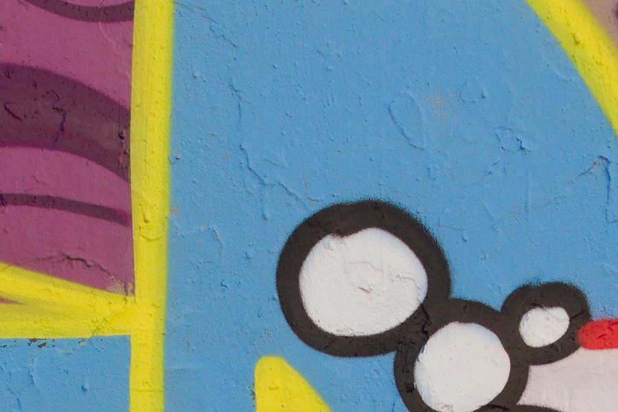 Photo 27486: Plastered wall with grafitti in blue, yellow, red, orange and green