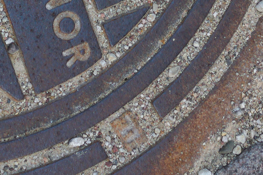 Photo 27494: Grey pavement with well cover